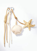 Grigri de sac coquillage et étoile de mer ÉLINE L'ATELIER
