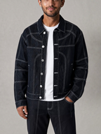 BROCK blue denim jacket and pants set with white contrast stitching worn by a man over a white t-shirt
