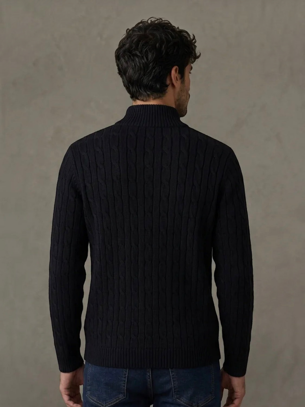 BROCK navy blue cable knit sweater with a mock neck collar worn by a man, back view