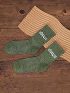 Chaussettes BROCK GALLANTRY vert pailleté avec inscription Rêveuse brodée, style festif mi-mollet