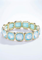 Bracelet élastique cristaux irisés multicolores monture dorée