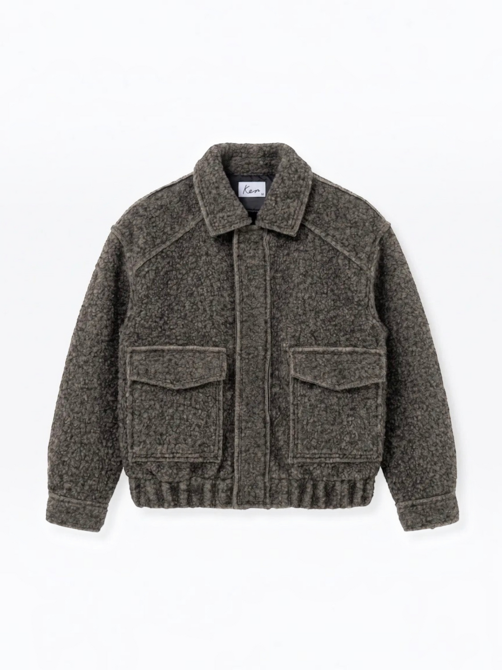 BROCK textured short jacket in dark grey with a structured collar, front flap pockets, and ribbed hem.