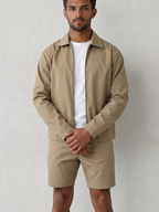 BROCK men's cafe brown two-piece jacket and trousers set in polyester blend worn over a white t-shirt