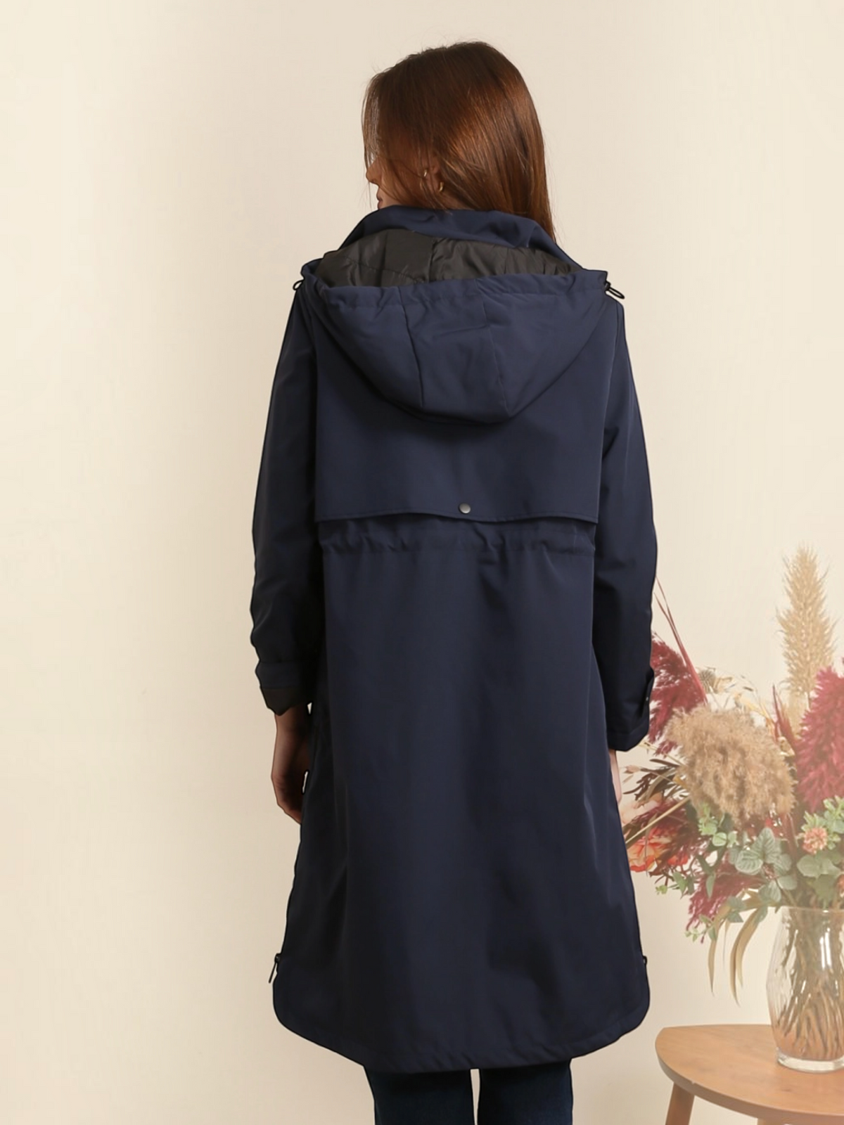 BROCK ATTRAIT PARIS navy blue long waterproof hooded jacket with adjustable drawstring waist, back view