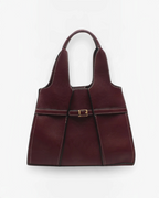 Sac cabas BROCK BESTINI bordeaux avec surpiqûres contrastantes, fermoir décoratif et bandoulière amovible.