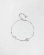 Bracelet BROCK en acier inoxydable avec chaîne fine, motifs lune et trèfle sertis de cristaux brillants