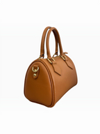 BROCK LOUISA LEE tan grained leather bowling bag with gold hardware and top handles, side view.