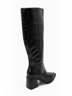 BROCK JOIA black high-heeled knee-high boots with a pointed toe and stable block heel, side view.