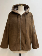 BROCK brown felted wool-blend zip-up jacket with a quilted hood, drawstring ties, and a sleeve pocket on a mannequin.