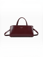Sac à main BROCK GALLANTRY La Rivance bordeaux à la silhouette allongée avec anses et bandoulière amovible