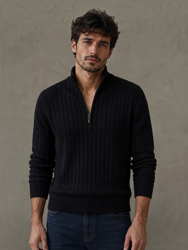 BROCK black cable knit sweater with a zip-up mock neck worn by a man against a neutral background.