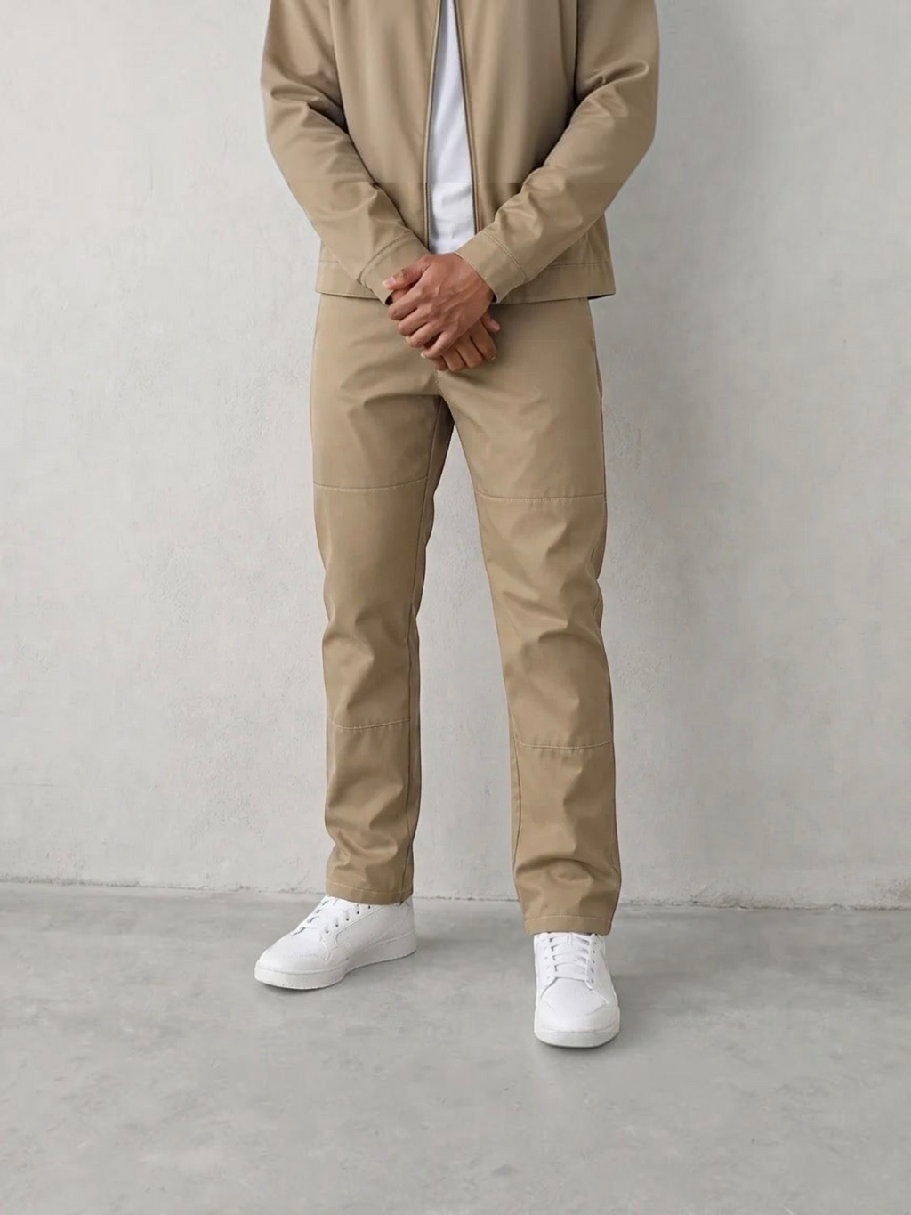 BROCK men's cafe brown two-piece suit set featuring a structured jacket and matching trousers with white sneakers.