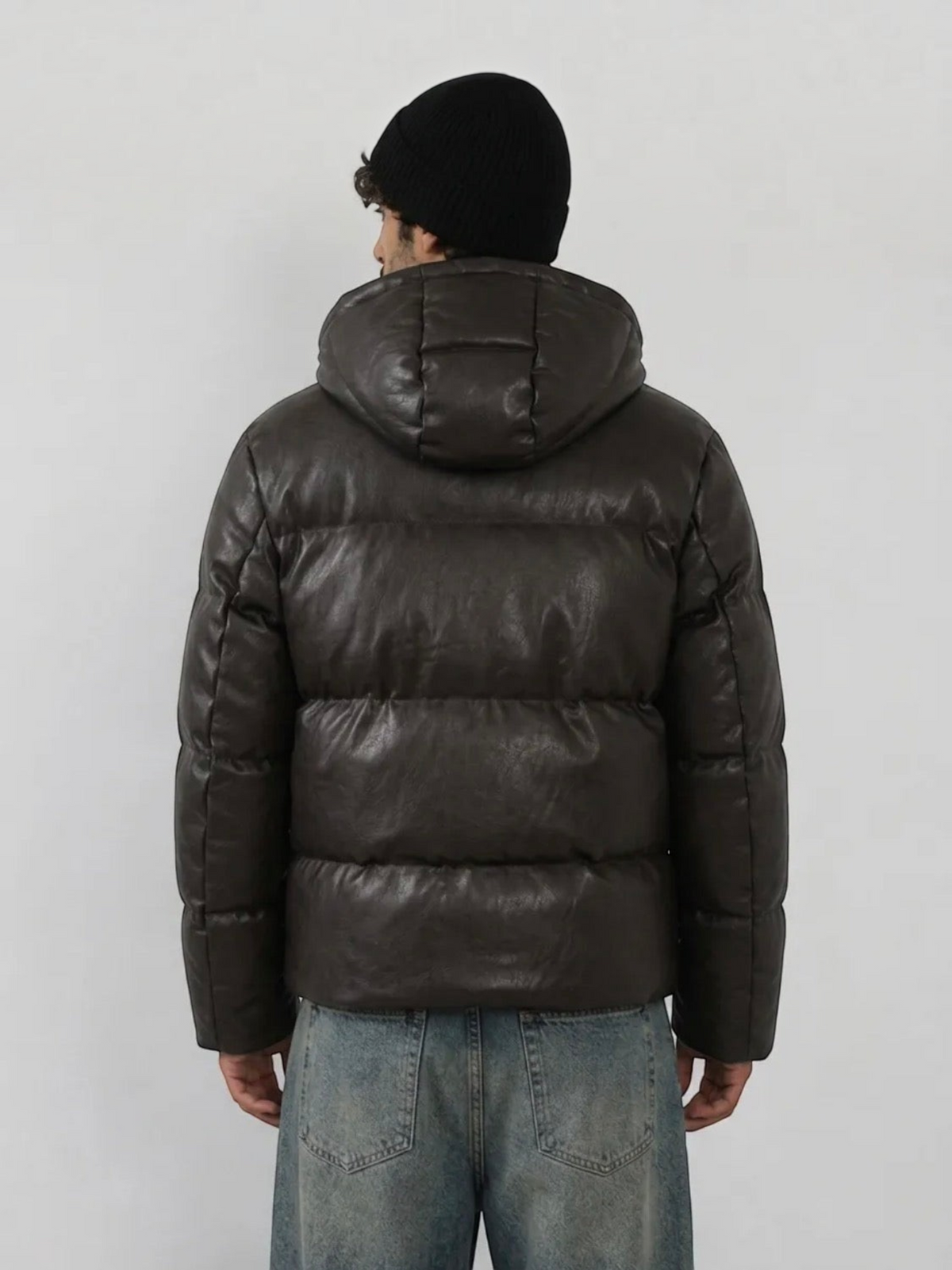 BROCK men's dark brown faux leather hooded puffer jacket worn with a black beanie, back view