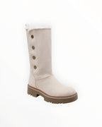 Bottes hautes d'hiver  en suédine beige, doublées de fausse fourrure, avec boutons décoratifs et semelle crantée.