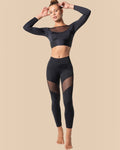 Model wearing BROCK ANAISSA black high-waisted sculpting sports leggings with mesh panels and matching crop top