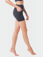 BROCK ANAISSA Halasana high-waisted black sports shorts with side pocket on a model for yoga and fitness