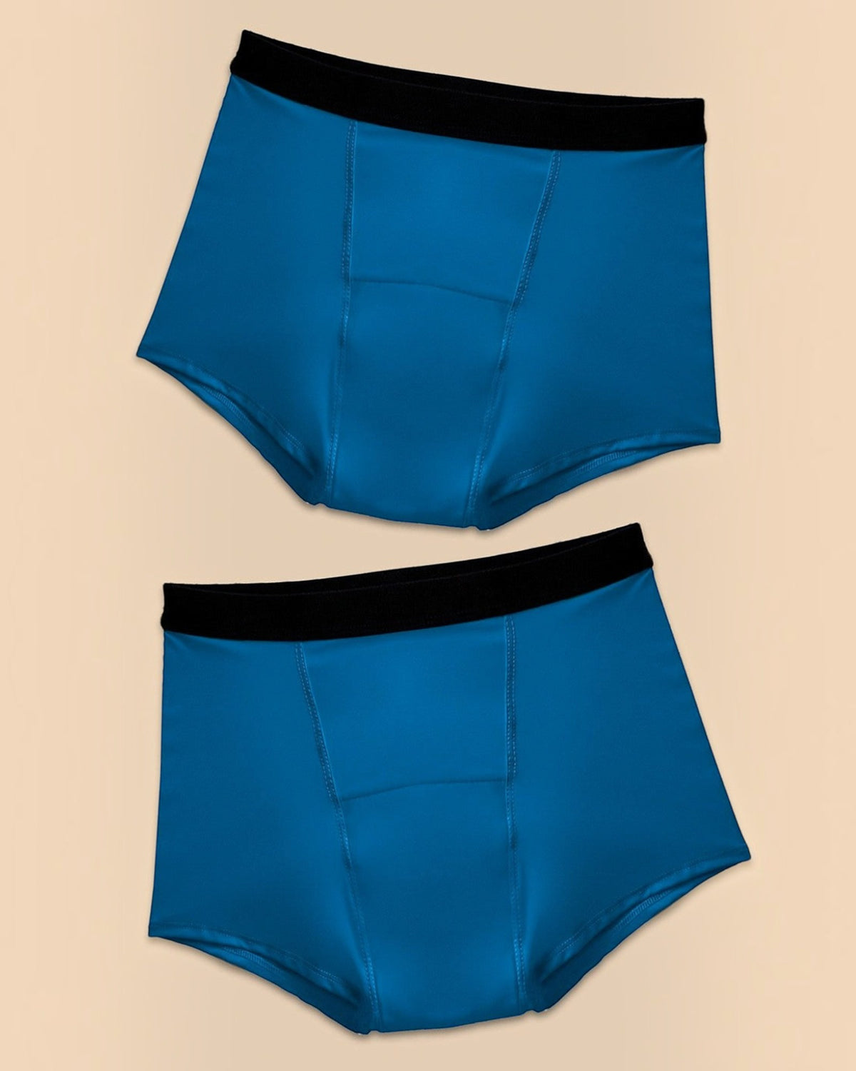 BROCK ANAISSA pack of two blue teen menstrual shorts with black elastic waistbands and absorbent design.