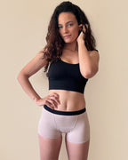 BROCK ANAISSA teen menstrual shorts in beige worn by a woman with curly hair, featuring a comfortable fit.