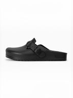 BROCK AVISPAS black EVA mule clogs with an adjustable buckle strap, featuring an anatomical and lightweight design.