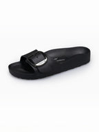 BROCK AVISPAS Milano black EVA vegan sandal with an adjustable translucent oval buckle and anatomical footbed.