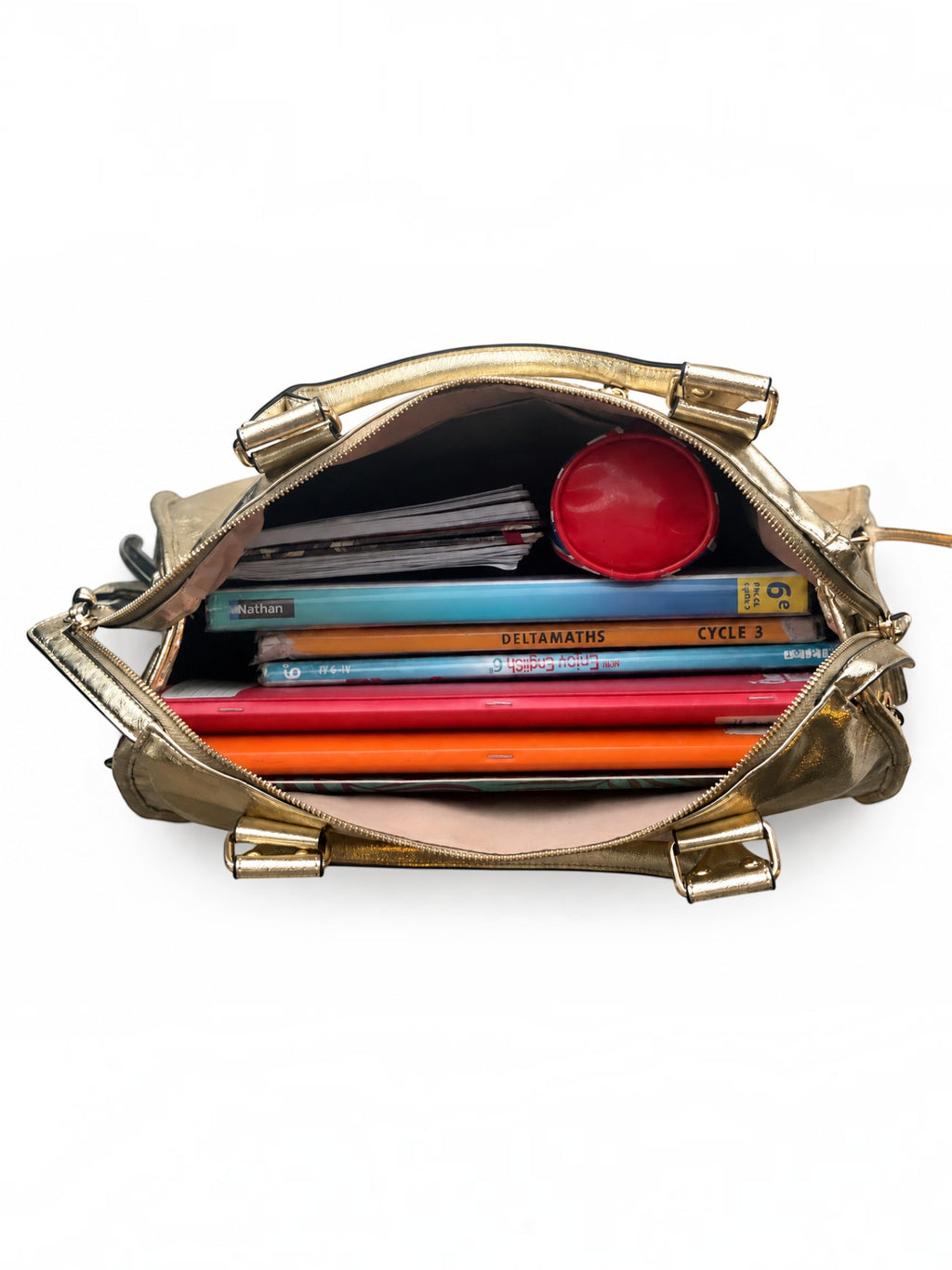 BROCK BAGSTORY gold faux leather A4 school bag filled with textbooks and a pencil case, top view