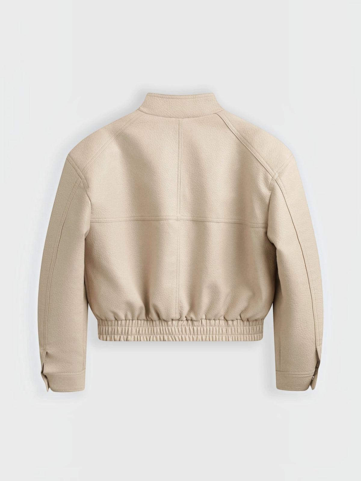 Back view of a beige BROCK faux leather cropped jacket with a stand collar and elasticated hem.