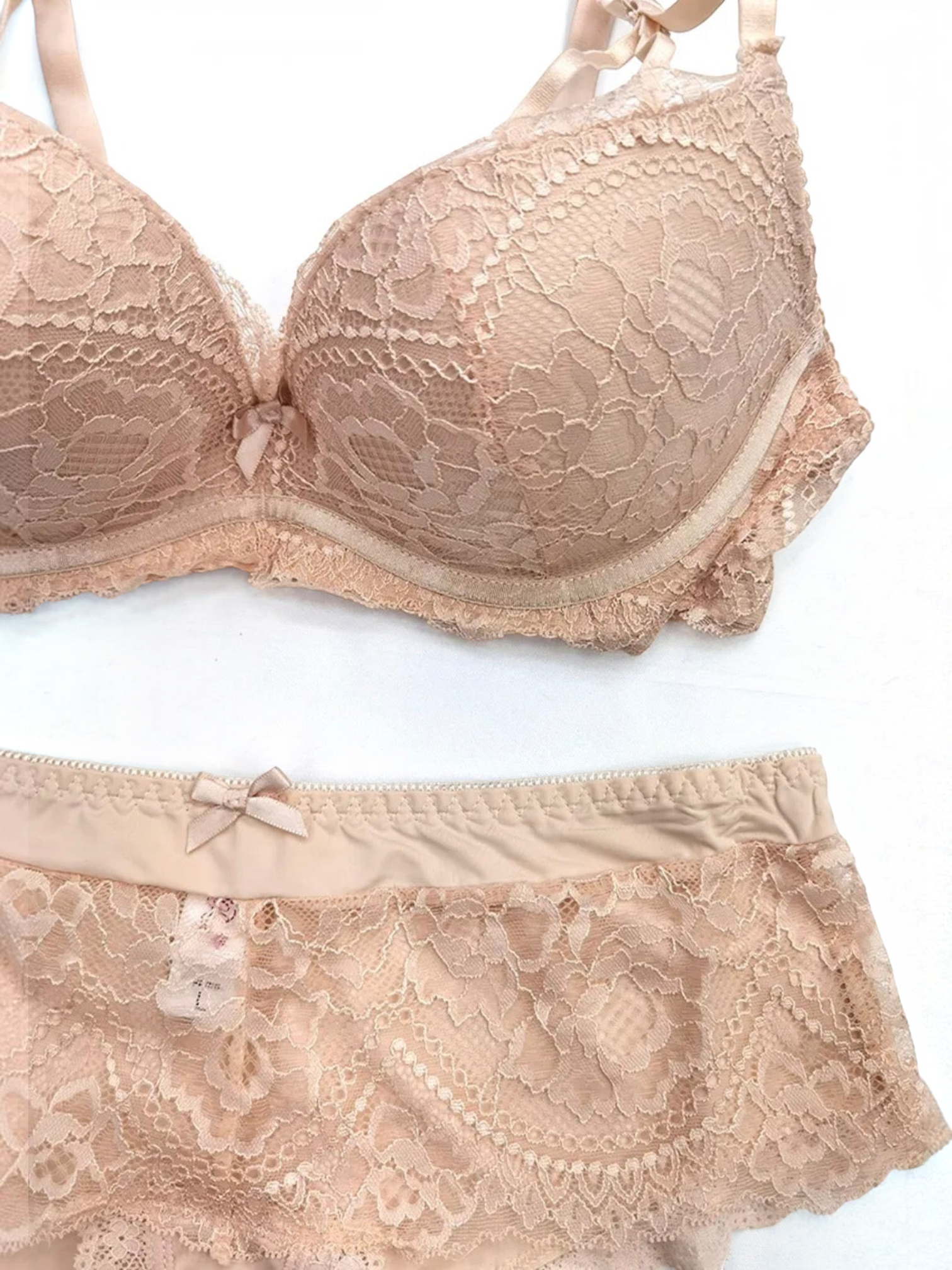 BROCK BELLE COM'ELLE beige lace lingerie set featuring a B-cup bra and matching panty with delicate bow details.