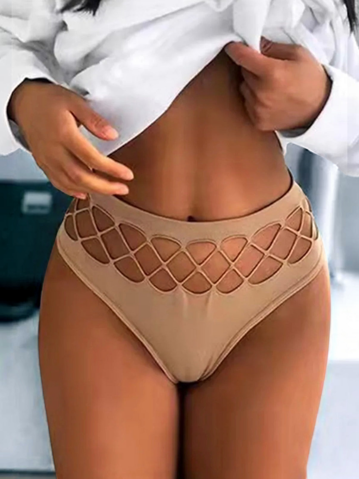 BROCK mid-rise thong by BELLE COM'ELLE in beige with intricate lattice cut-out detailing on the waistband.