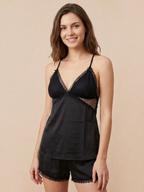 Model wearing a black BROCK BELLE COM'ELLE pajama set with a lace-trimmed camisole and matching shorts.