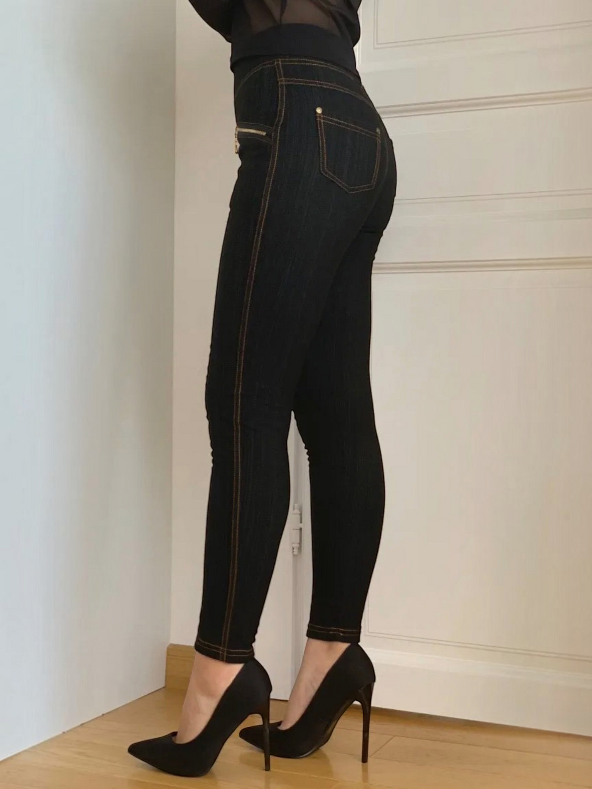 BROCK BELLE COM'ELLE black shaping leggings with contrast stitching worn with high heels, side view