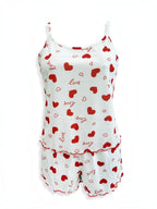BROCK BELLE COM'ELLE two-piece pajama set in white with red heart print, featuring a ribbed camisole and shorts.