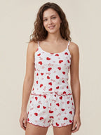 Model wearing BROCK BELLE COM'ELLE white ribbed pajama set with red hearts and love print, featuring camisole and shorts