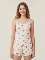 Model wearing a BROCK BELLE COM'ELLE ribbed pajama set with teddy bear and heart print, featuring a camisole and shorts