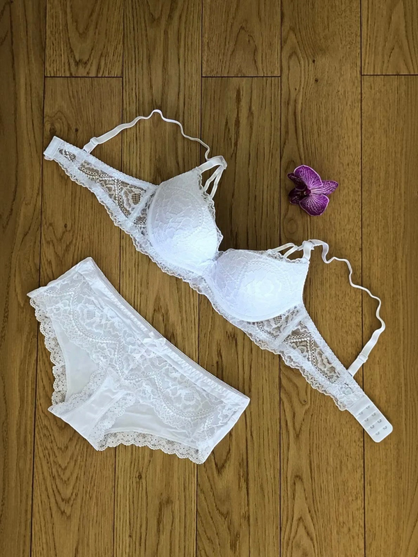 BROCK BELLE COM'ELLE white lace lingerie set with bra and matching panties on a wooden floor