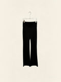 BROCK black high-waisted flared leggings made from polyamide and elastane blend hanging on a hanger