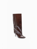 BROCK brown faux leather knee-high boots with a glossy crocodile effect, pointed toe, and slim stiletto heel.