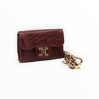 BROCK mini burgundy faux crocodile crossbody bag with gold chain strap and C.Clo logo hardware