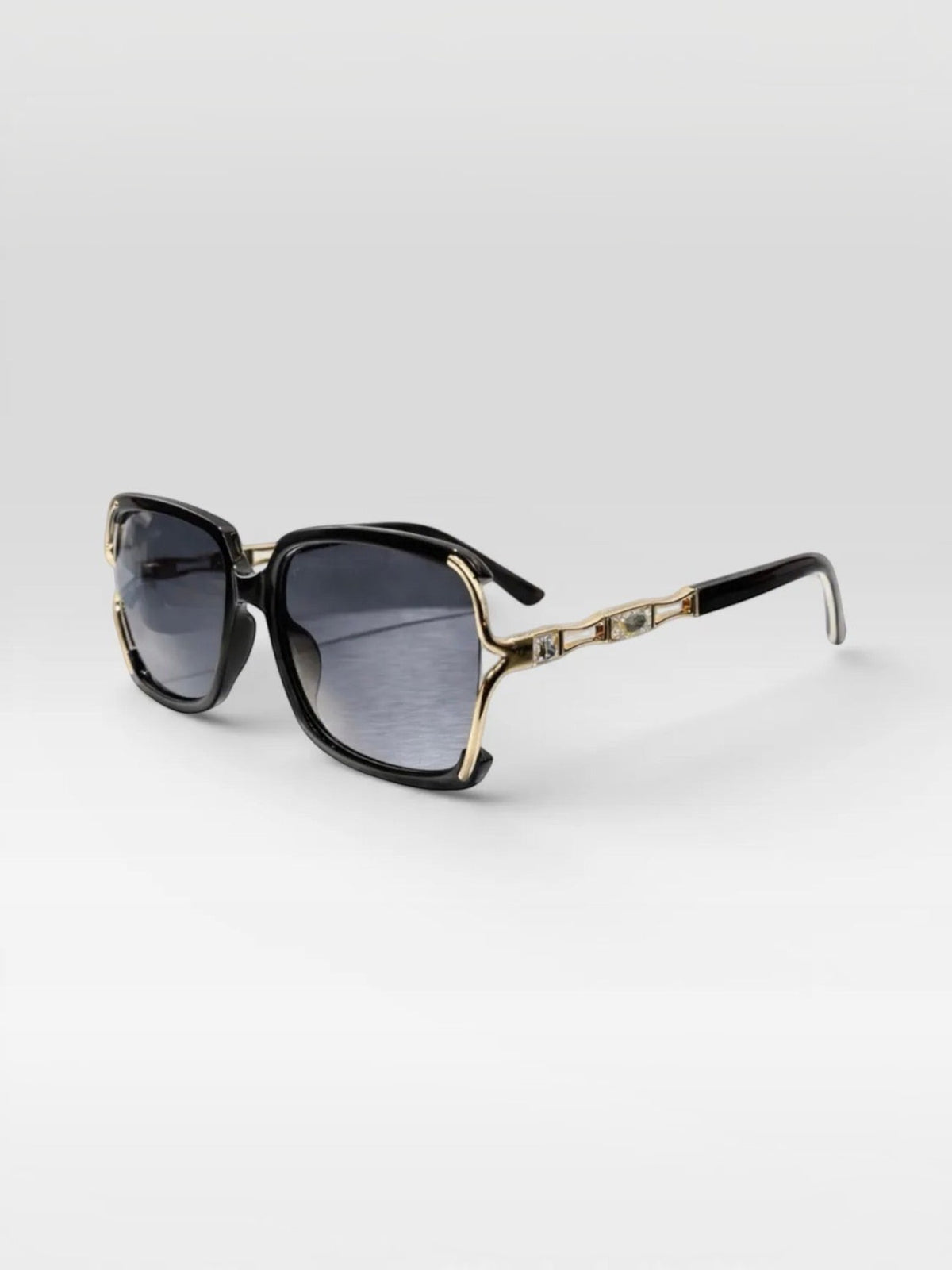 BROCK BYREN | ÉLINE L'ATELIER sunglasses with black square frames, gold accents, and gradient lenses.