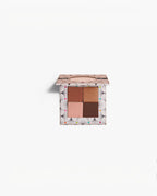 BROCK CHARLOTTE BIO 4-shade eyeshadow palette with matte and metallic brown, gold, and beige powder pigments.