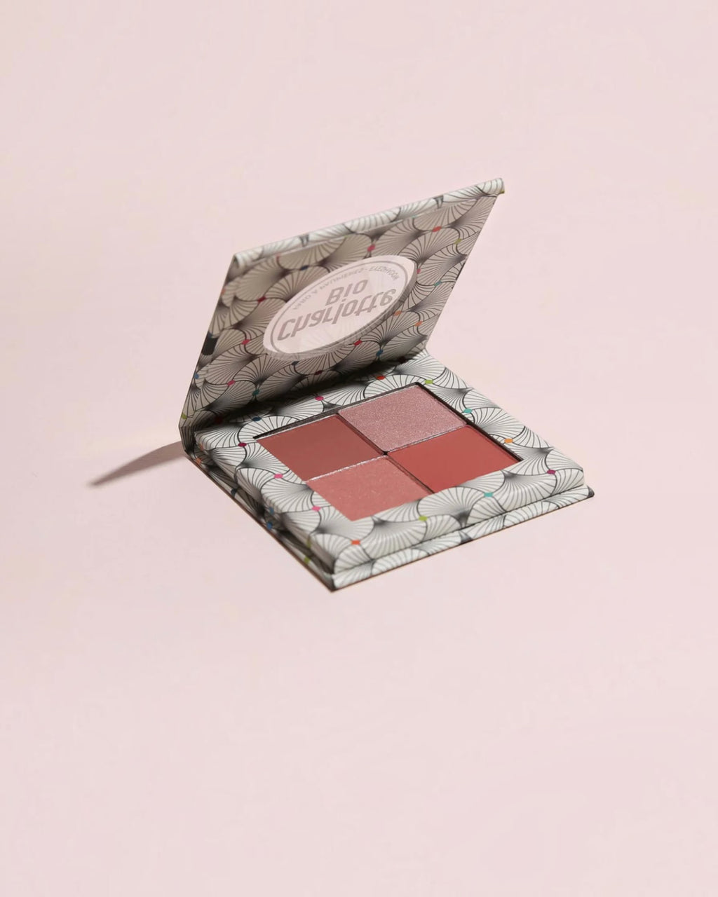 BROCK Charlotte Bio eyeshadow palette with four velvet powder shades in a patterned compact case.