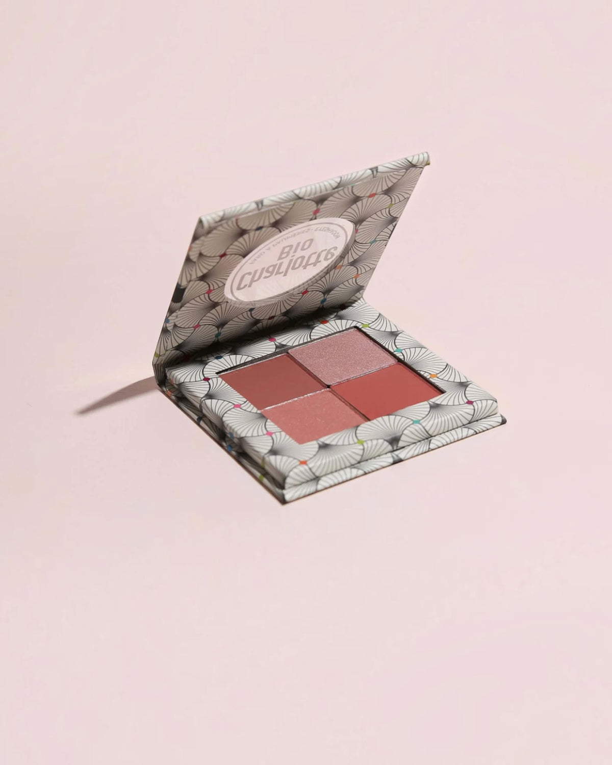BROCK Charlotte Bio eyeshadow palette with four velvet powder shades in a patterned compact case.