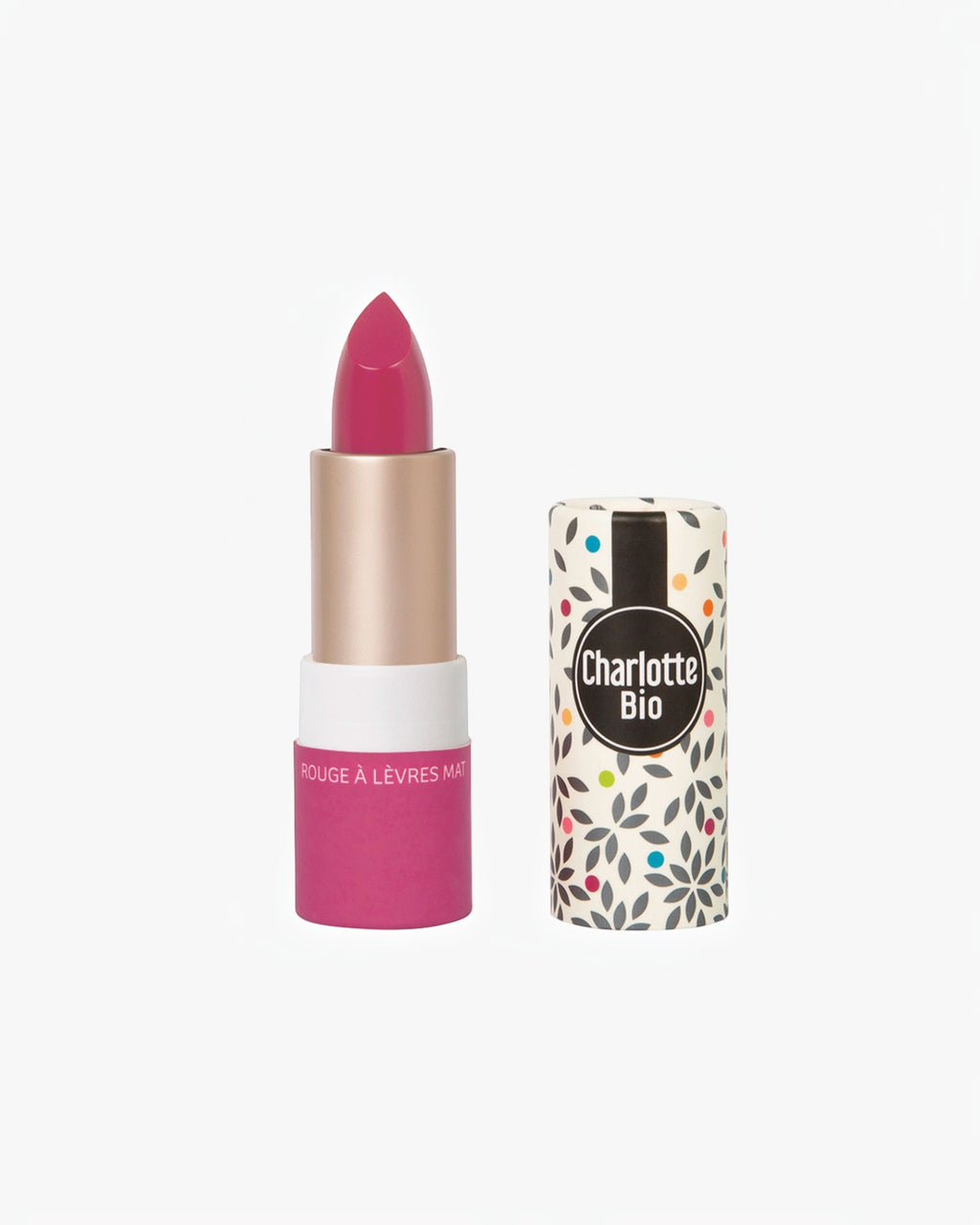 BROCK Charlotte Bio matte lipstick in a vibrant pink shade with natural ingredients and patterned packaging.