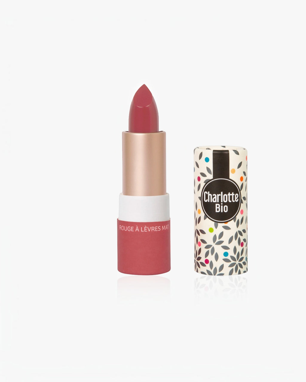 BROCK Charlotte Bio matte lipstick in a deep rose shade with a patterned paper tube and natural ingredients.