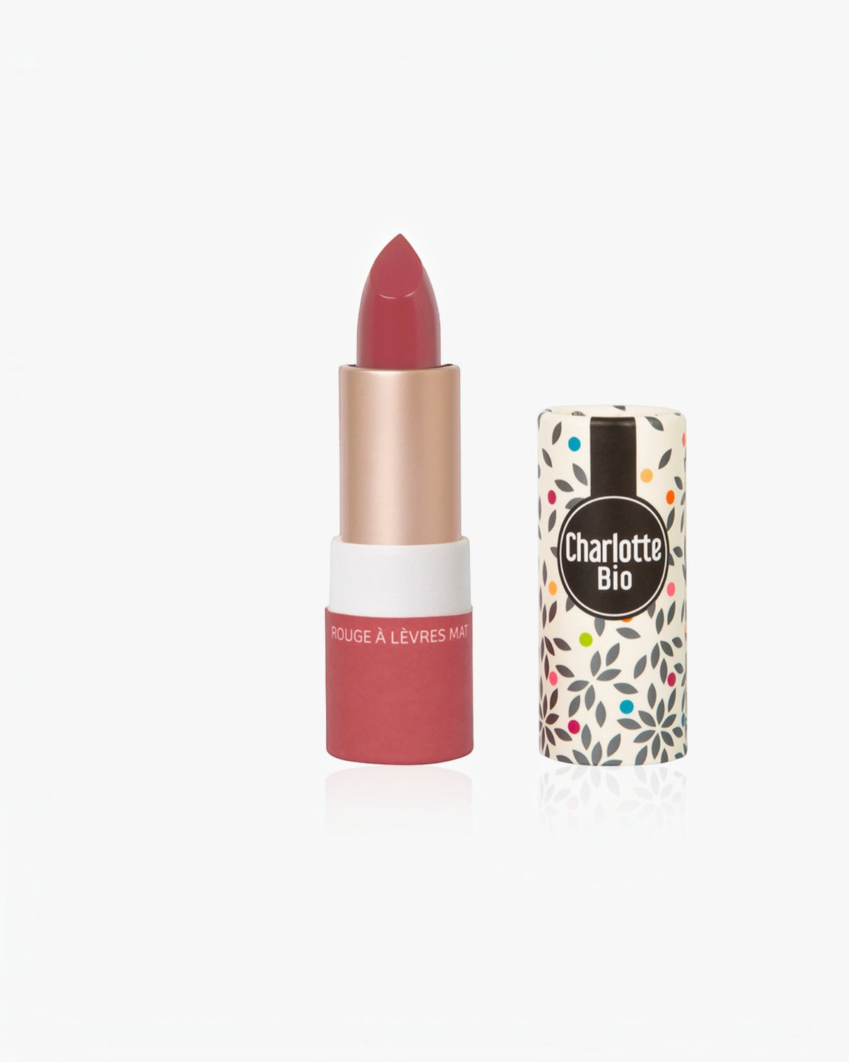BROCK Charlotte Bio matte lipstick in a deep rose shade with a patterned paper tube and natural ingredients.