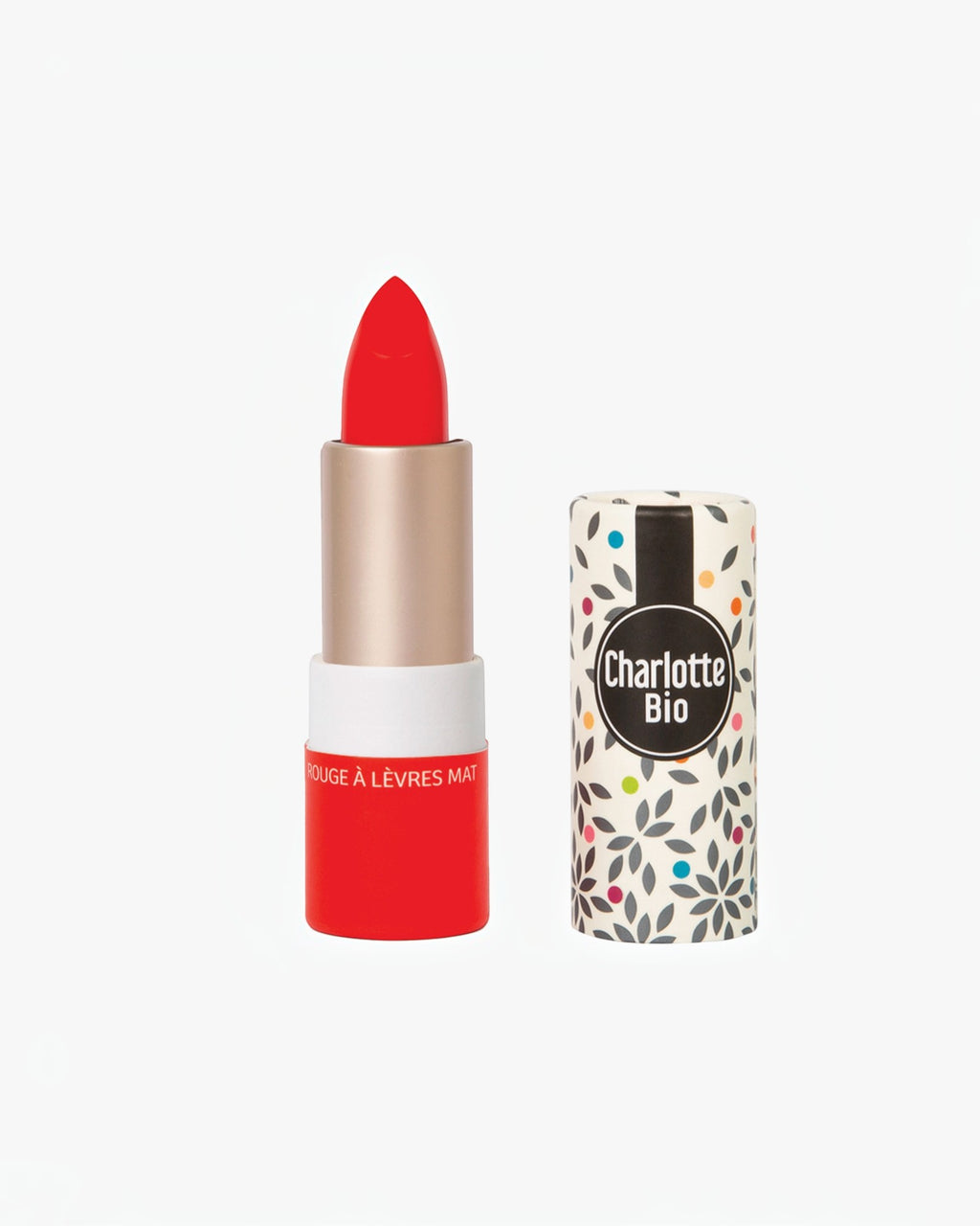 BROCK Charlotte Bio matte lipstick in a vibrant red shade with natural ingredients and patterned eco-friendly packaging.