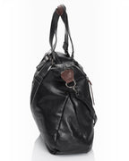 BROCK COLMA large black faux leather tote bag with side view, featuring decorative zipper tassels and sturdy handles.