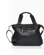 BROCK COLMA large black faux leather tote bag with sturdy handles, adjustable shoulder strap, and zipper details.