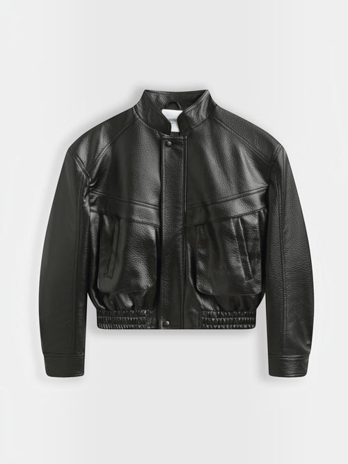 BROCK Copperose black faux leather cropped jacket with structured shoulders, mandarin collar, and flap pockets.