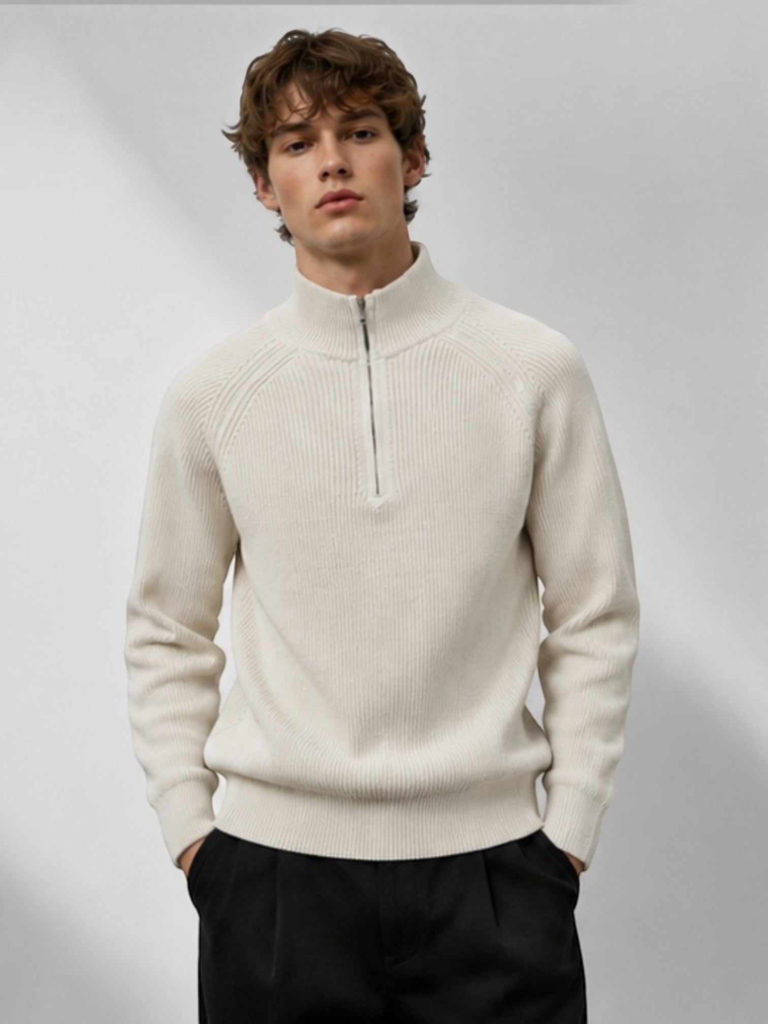 Model wearing a BROCK cream ribbed knit half-zip sweater with raglan sleeves and a high collar.