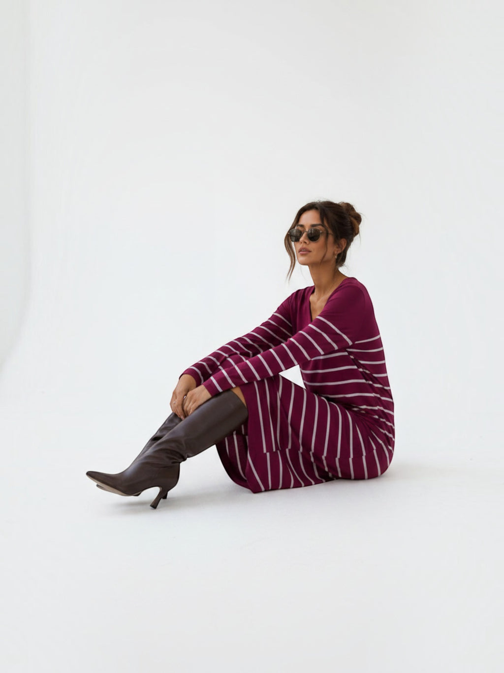 BROCK EMMA & ASHLEY long sleeve striped maxi dress with V-neck worn by a woman with brown boots on a white background
